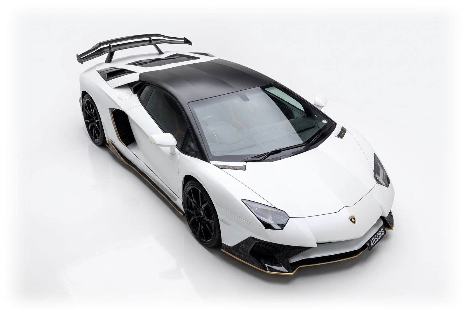 Elevated studio view of the ABSORB Aventador showing roof, bonnet and SV wing