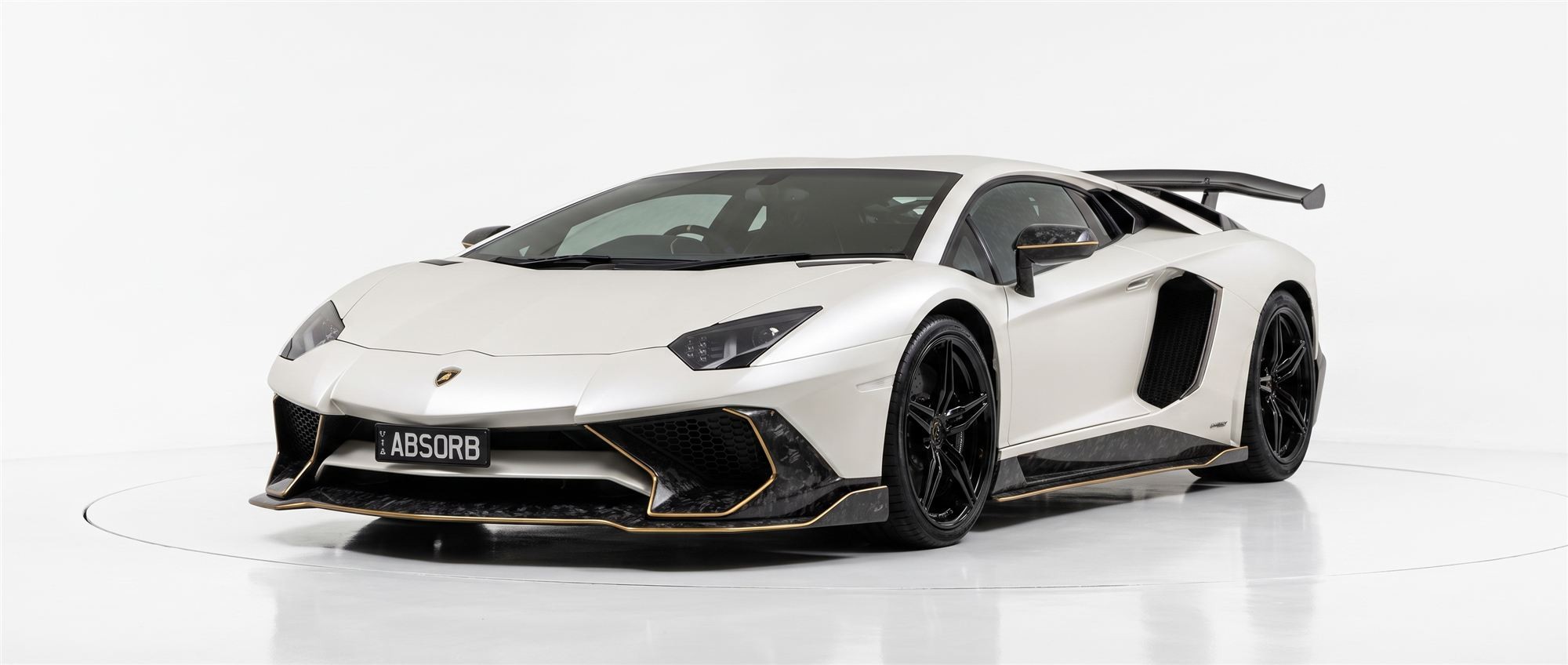 Front three-quarter studio view of the ABSORB Aventador